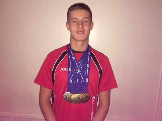 Joel Thompson with his seven British Championship gold medals