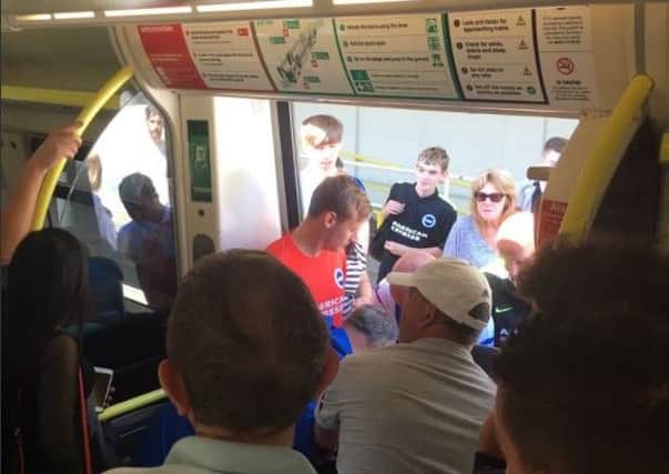 Simon Gregg took this photo of passengers helping the disabled woman