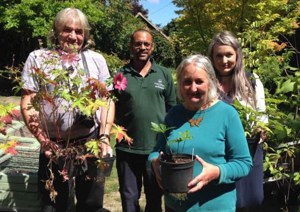 Winner Katie Wade and her mum and dad, Howard and Deborah, with Highdown Head Gardener Gary Prescod and their chosen plants