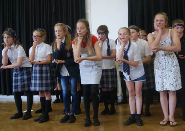 Pupils performing at Felpham Community College