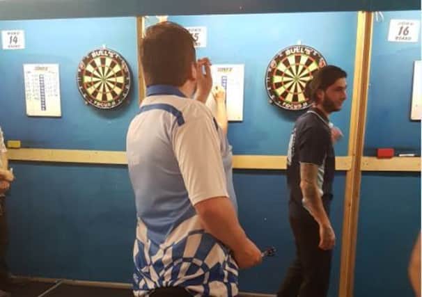 Mike Few playing darts in Germany
