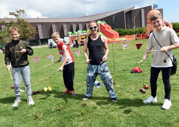 Rain failed to stop 600 people trying out various circus skills. Pictures: Liz Pearce