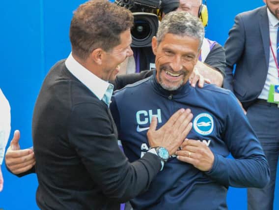 Albion boss Chris Hughton pictured with Atletico Madrid manager Diego Simeone. Picture by Phil Westlake (PW Sporting Photography)