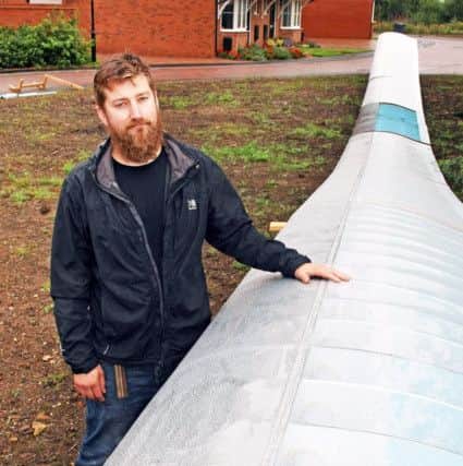 Sam Penny pictured with part of his flying machine. Pic: Derek Martin DM17737122a