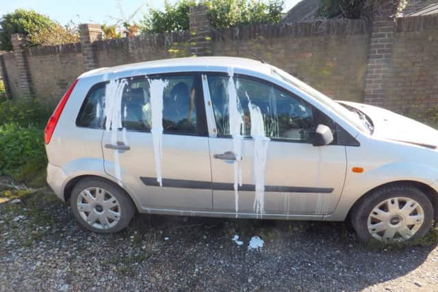The cars covered in paint in Well Road, Pagham