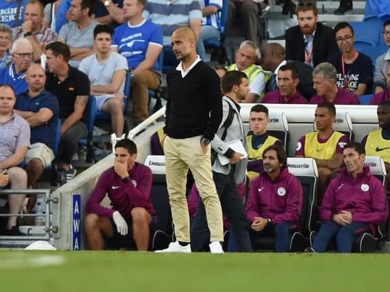 Pep Guardiola watches on at the Amex. Picture by Phil Westlake (PW Sporting Photography)