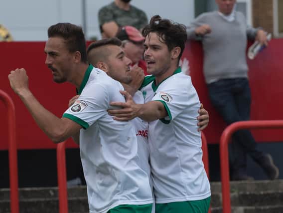Jimmy Muitt, scorer Ollie Pearce and Harvey Whyte celebreat Bognor's third at Welling / Picture by Tommy McMillan