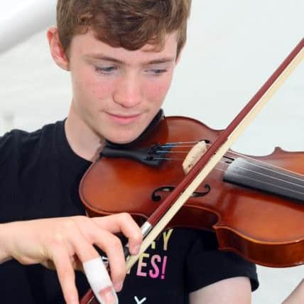 Violinist Joey Johnston, 16. Photo by Derek Martin DM17839410a