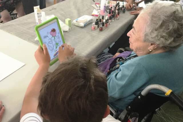 Residents were shown games and activities on an iPad