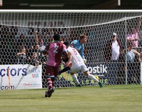 Jack Dixon scores Hastings United's opening goal against Corinthian-Casuals on Saturday. Picture courtesy Scott White