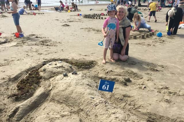 Emma London and her daughter Holly, five, with their mermaid entry in the Littlehampton sandcastle competition