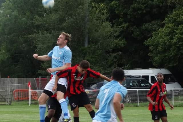 Two-goal Drew Greenall wins a header. Picture courtesy Mark Killy