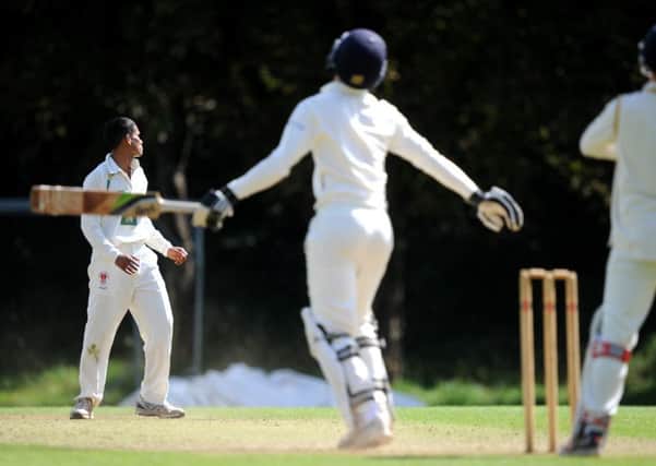Cricket. Three Bridges (fielding) v Billingshurst. Rob Woodman is caught after a Anish Paraam delivery. Pic Steve Robards SR1718625 SUS-170814-110132001