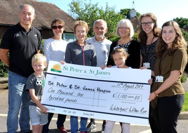 Haywards Heath Harriers donate Â£1,100 to St Peters and St James Hospice. Pic Steve Robards