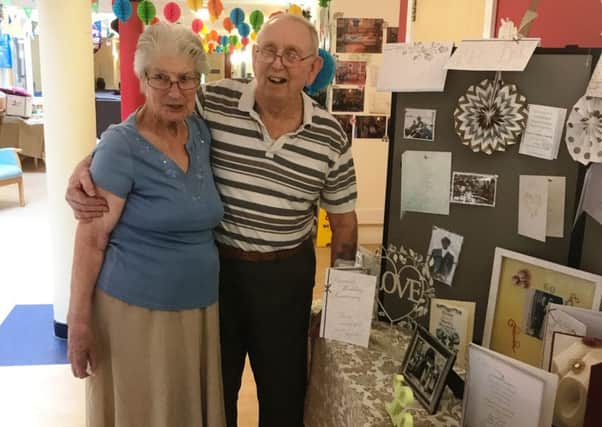 John and Audrey Munday with the 60th wedding anniversary display