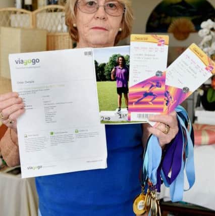 Margaret Brewster with the Viagogo confirmation letter and the tickets