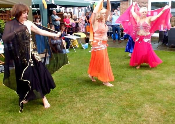Belly dancers performing at the garden gathering