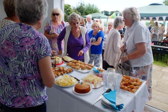 Serving cream teas to guests