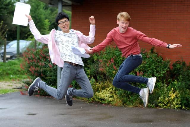 Kyo Kaneko and Harry Verhoef. A level results day at Weald School sixth form in Billingshurst. Pic Steve Robards SR1719162 SUS-170817-110826001