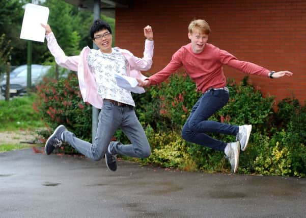 Kyo Kaneko and Harry Verhoef. A level results day at Weald School sixth form in Billingshurst. Pic Steve Robards SR1719162 SUS-170817-110826001