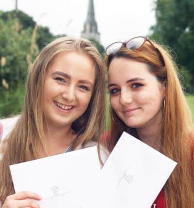 DM17840591.jpg Chichester College A-level results 2017. Agnese Sproge 16, left and Lilly Vaughan-Smith 17. Photo by Derek Martin SUS-170817-122319008