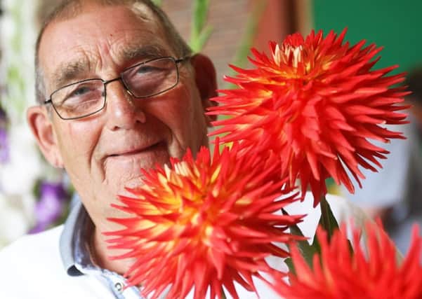 Ted Love and his prize-winning dahlias at Felpham and Middleton Horticultural Societys flower and produce show. Picture: Derek Martin DM17841328a