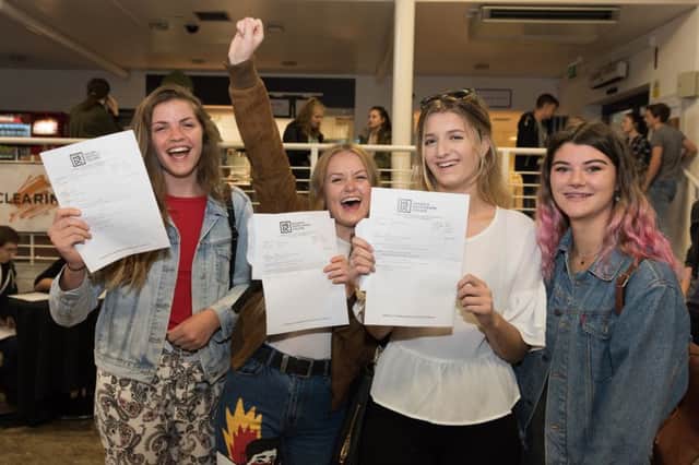 Delighted students on results day. Photo by Duncan Shepherd