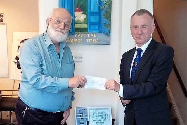 Bognor Regis Rotary Club secretary Neil Holloway presents the Â£650 cheque to Tim Bird, trustee and founder member of Capital Project Trust l5UXcqXyRRN6P2n-KOvn