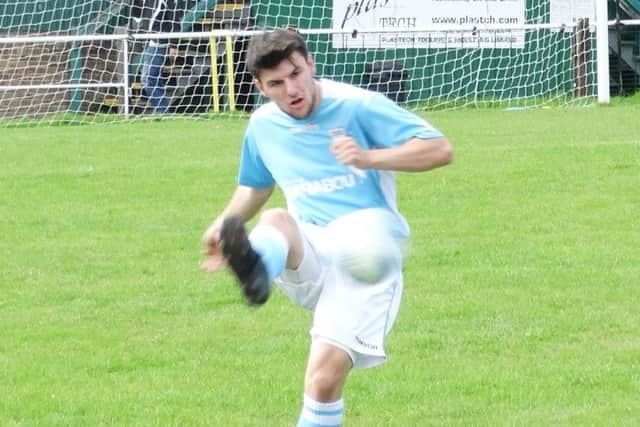 Bexhill United goalscorer Connor Robertson plays the ball forward. Picture courtesy Mark Killy