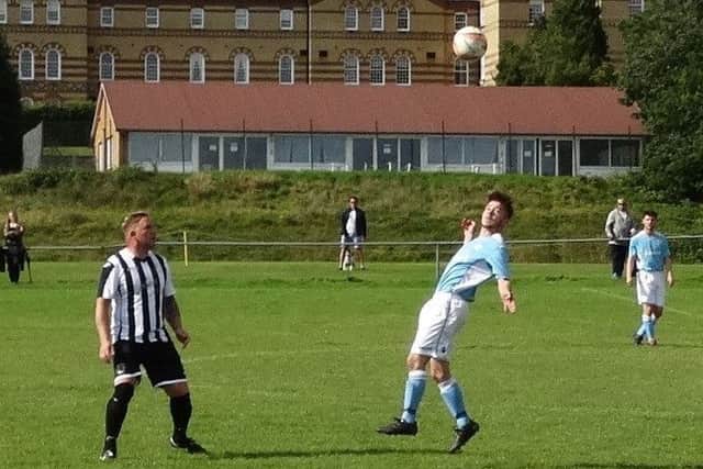Bexhill United midfielder Kyle Holden gets his head to the ball. Picture courtesy Mark Killy