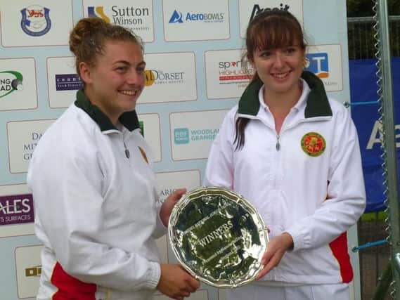Emma Cooper (right) and Morgan Merryweather with their prize for winning the Women's National Under-25 Pairs title.