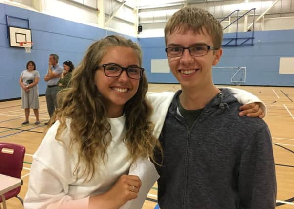 Twins Rebecca and James Angus shared 21 A* to A grades