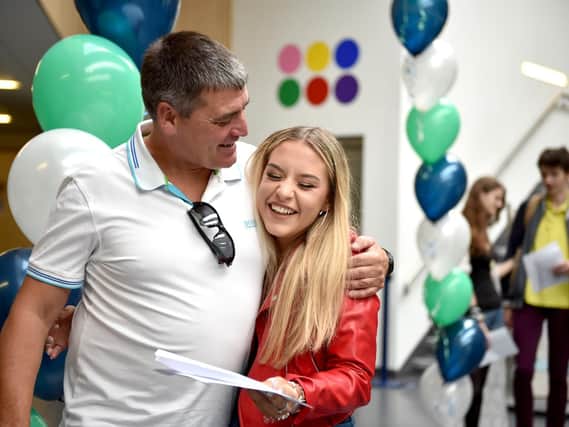Toni Gander from BACA in Brighton with her father Grant getting her GCSE results  (Photograph: Simon Dack / Vervate)