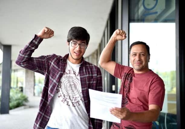 Hummd Ghouri with his father Ahmed from BACA in Brighton getting his GCSE results (Photograph: Simon Dack / Vervate)