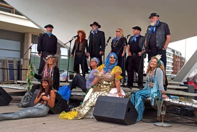 Bexhill Festival of the Sea 2015. The Hastings Shanty Singers entertain the crowds with the Hastings Mermaids adding some glamour. Picture by Stephen Curtis