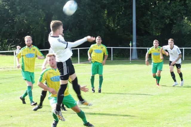 Corey Wheeler wins a header during Bexhill United's 1-1 draw away to Hailsham Town on Saturday. Picture courtesy Mark Killy