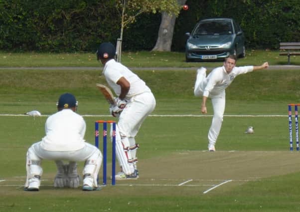 Bexhill spinner Josh Beeslee bowls to Cuckfield century-maker Jeet Raval. Pictures by Simon Newstead