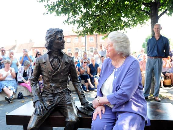 Dame Patricia Routledge unveils the new statue of Keats watched by the sculptor Vincent Gray