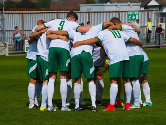The Rocks players huddle before Monday's game with Eastbourne. Picture by Tommy McMillan