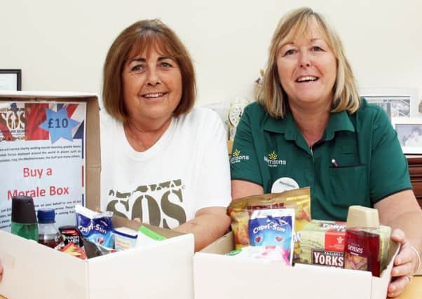 DM1790585a.jpg Support Our Soldiers charity thanks its supporters. Head volunteer Penny Keen, left and Alison Whitburn, Morrisons community champion. Photo by Derek Martin SUS-170409-154104008