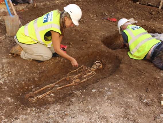 Archaeologists unearthing the remains beneath the Corn Exchange