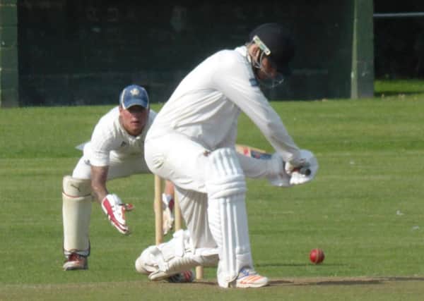 Fin Thomson shapes up to play a drive for Rye against Seaford. Pictures by Simon Newstead
