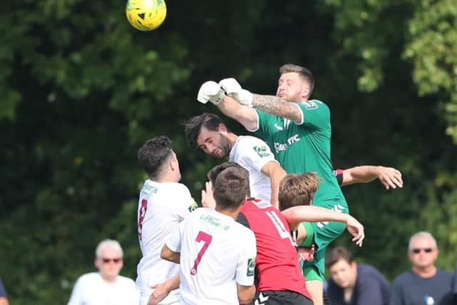 Lewes goalkeeper Chris Winterton comes under pressure at The Pilot Field on Monday. Picture courtesy Scott White