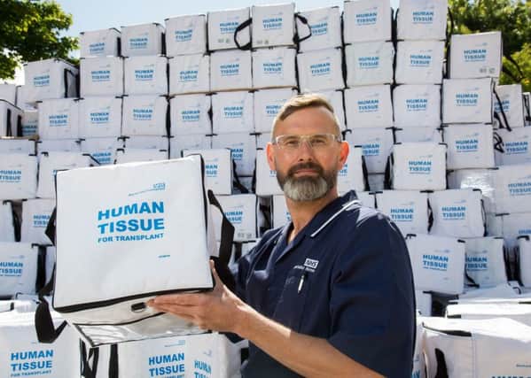 NHSBT nurse Marc Coe with empty transplant boxes showing missed opportunities.