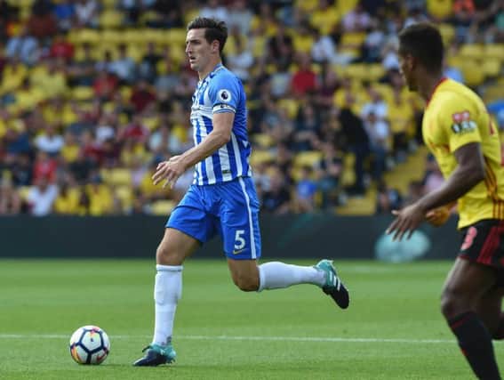 Lewis Dunk in action at Watford. Picture by Phil Westlake (PW Sporting Photography)