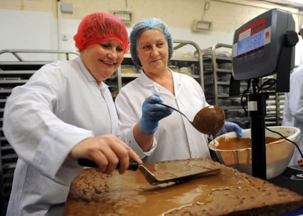 Caron Howe with Irene Bernotiene in the bakery in 2011. Picture Kate Shemilt