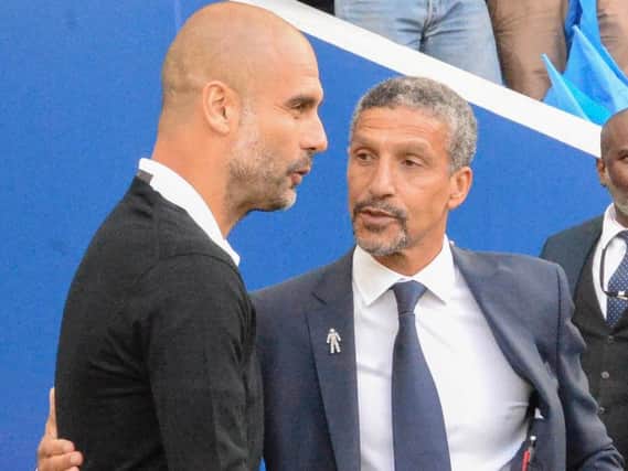 Brighton boss Chris Hughton pictured with Manchester City manager Pep Guardiola. Picture by Phil Westlake (PW Sporting Photography)