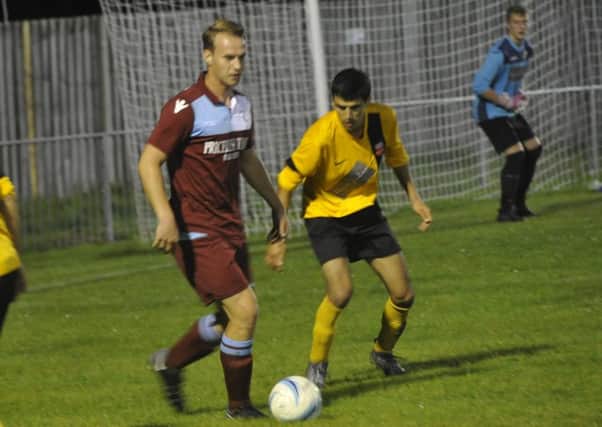 Sam Ellis on the ball during Little Common's 4-1 win over Seaford Town on Tuesday night. Picture by Simon Newstead