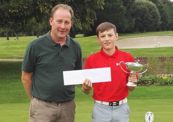 Bognor junior champion Harry Isham receives his prize