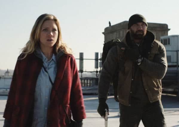 Dave Bautista and Brittany Snow in Bushwick